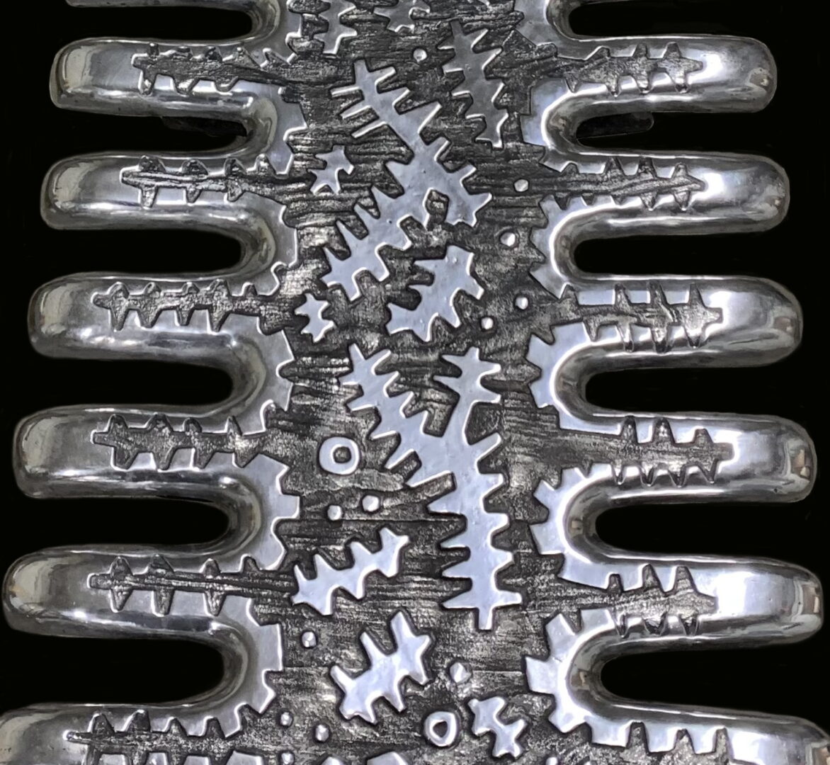 A close up of the metal gears on an engine