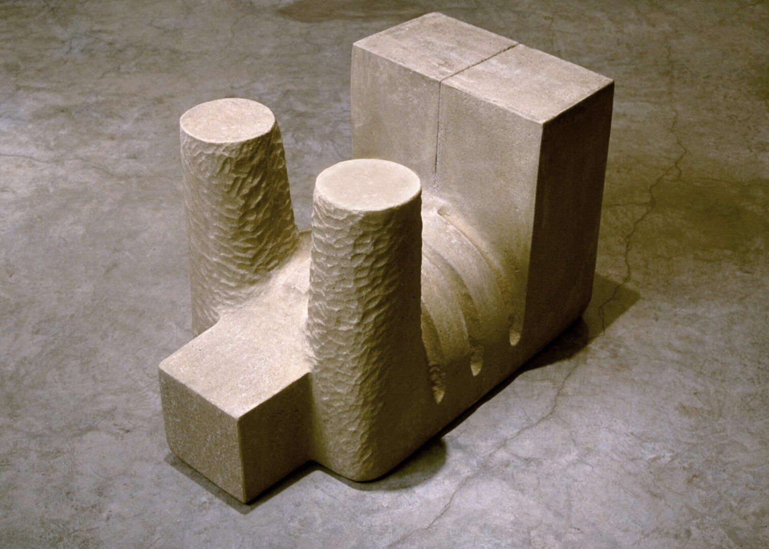 A concrete block with two pillars on top of it.