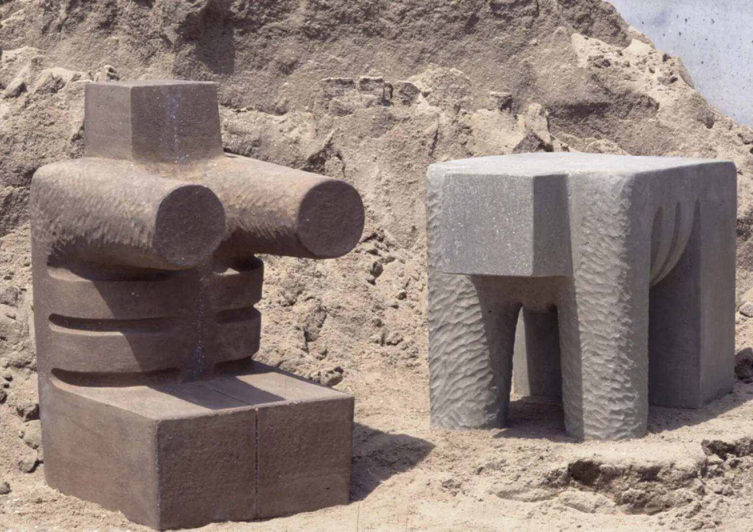 A stone sculpture of two blocks and one block