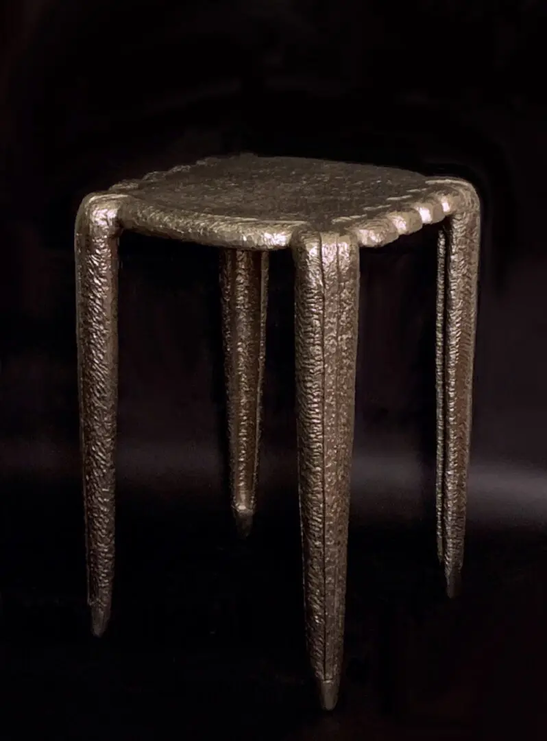 A metal table with a black background